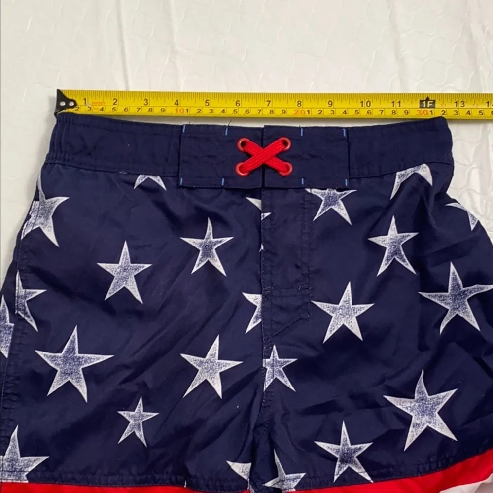 Cat and Jack American Flag red white blue swim trunks L = 12-14